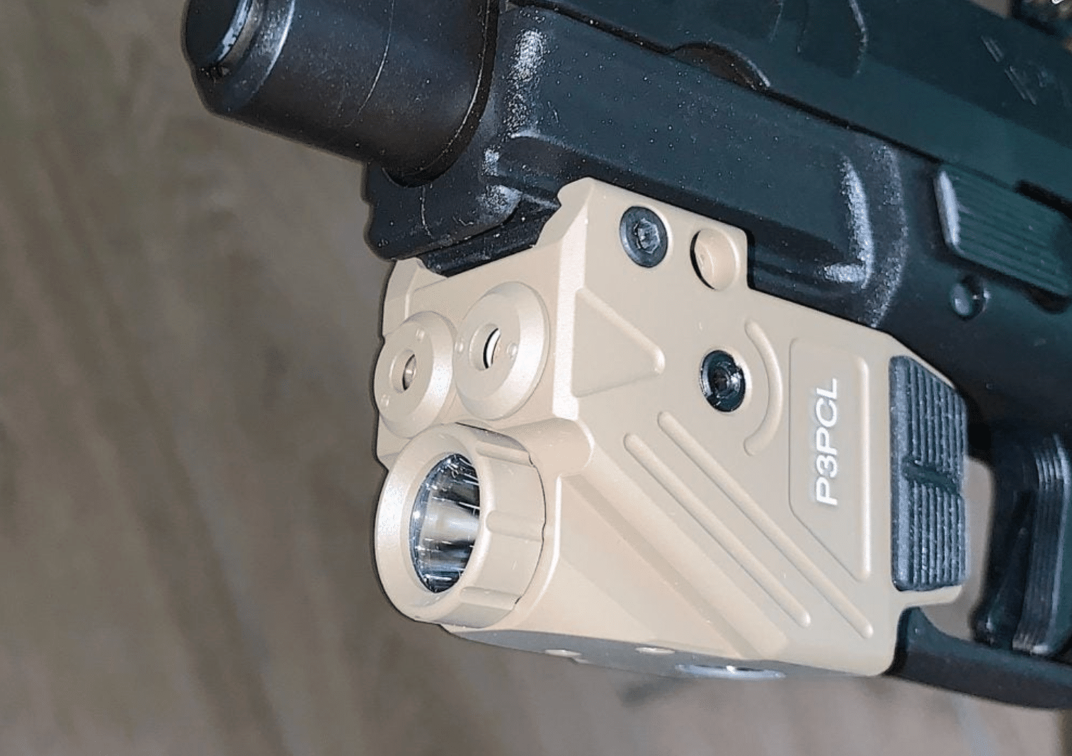 HiLight Tactical Enforcer and Peak Performance weapon lights in Cerakote FDE finish mounted on pistol